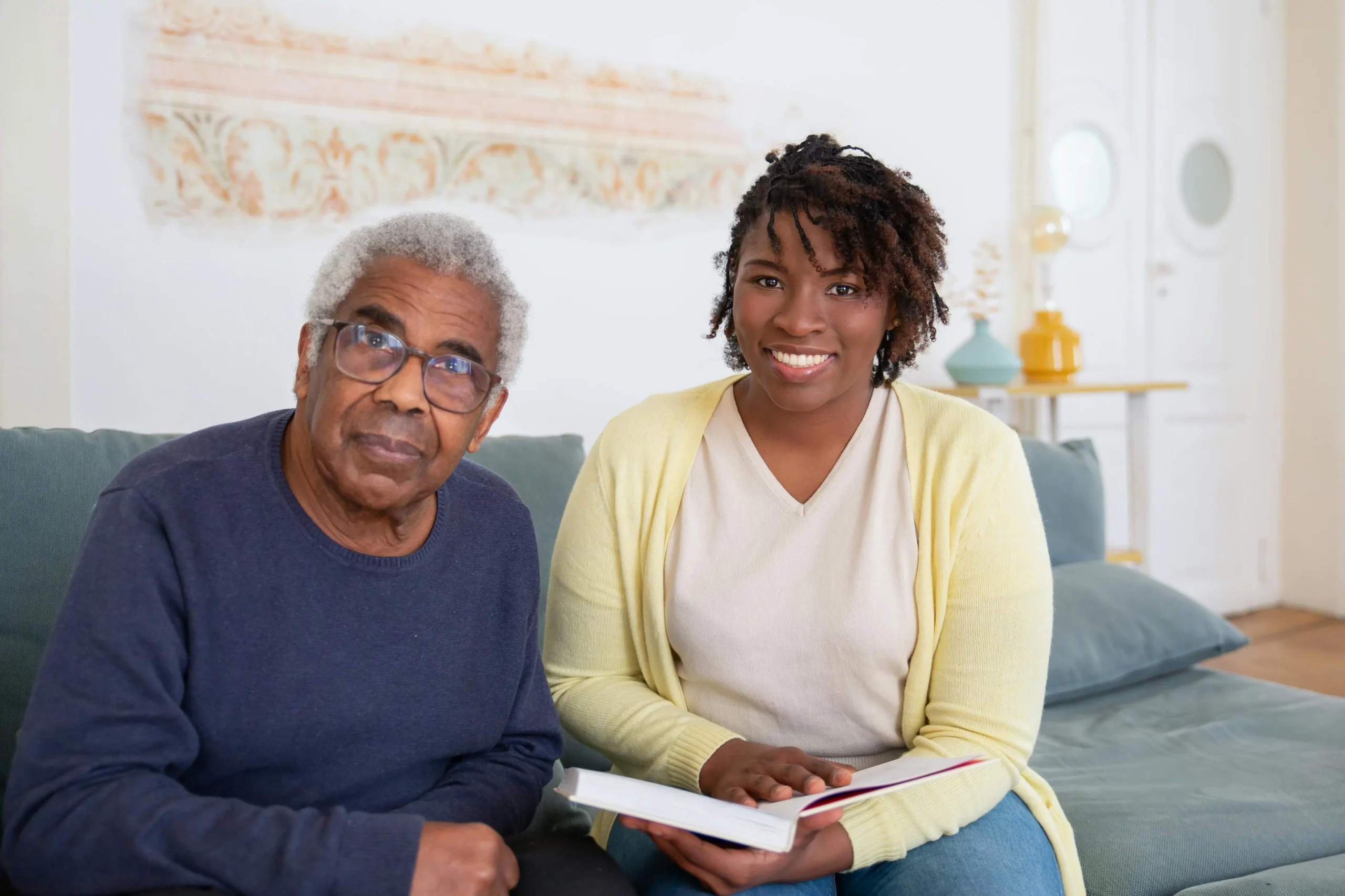 A Viceroy caregiver providing warm, attentive support to an elderly client at home