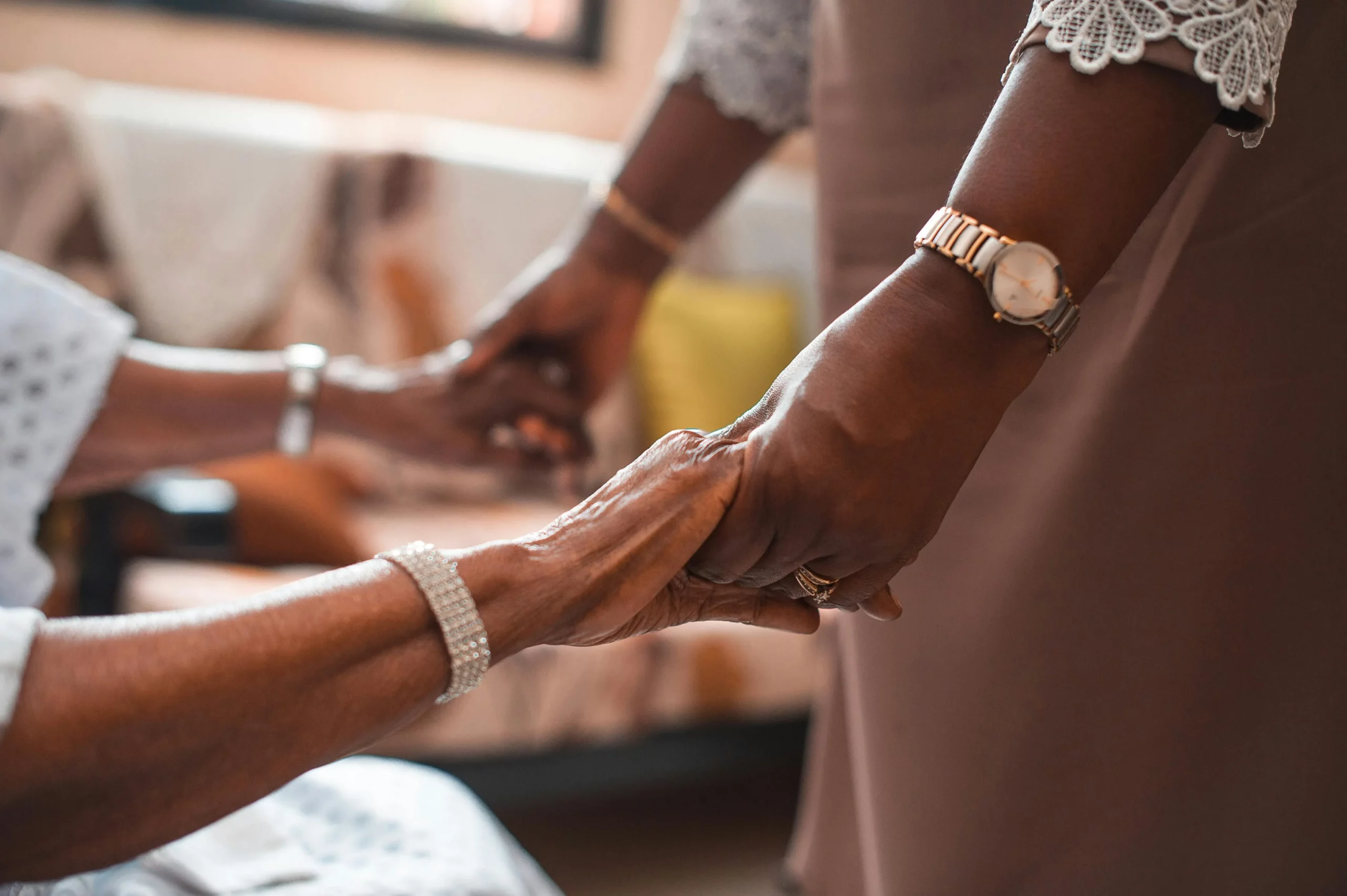 A Viceroy caregiver sharing a warm conversation with an elderly client at home